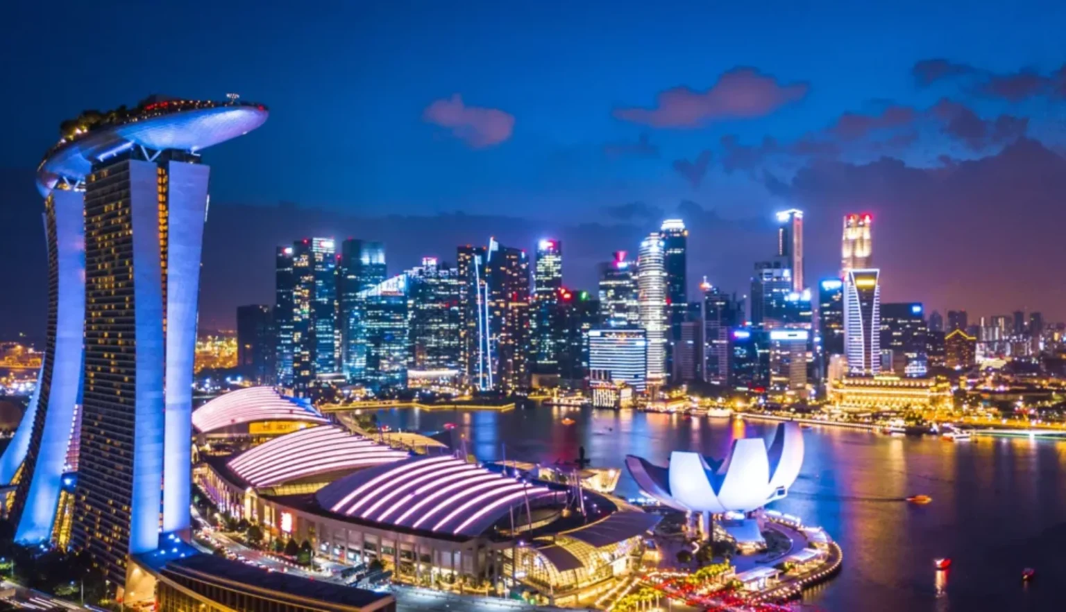 Aerial view of Singapore skyline at night near Marina Bay, Singapore_shutterstock_1116483092.jpg